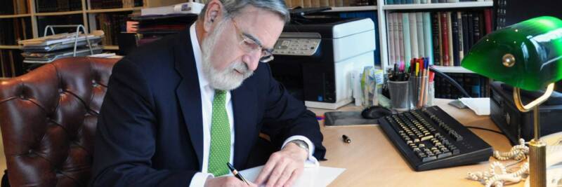 rabbi sacks in his study 2016 reading room writing signing learning working limmud