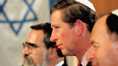 The Prince of Wales, centre, wearing a kippa (skull cap), with the Chief Rabbi Dr Jonathan Sacks, left, and the Israeli Ambassador to the UK Dror Zeigerman, right, at the United Synagogue in St Johns Wood, London tonight. The Prince attended a service to mark the 50th anniversary of the establishment of the state of Israel. PA Photo/pool/WPA.   (Photo by PA Images via Getty Images)