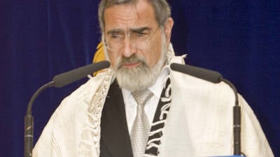 The Prince of Wales, centre, wearing a kippa (skull cap), with the Chief Rabbi Dr Jonathan Sacks, left, and the Israeli Ambassador to the UK Dror Zeigerman, right, at the United Synagogue in St Johns Wood, London tonight. The Prince attended a service to mark the 50th anniversary of the establishment of the state of Israel. PA Photo/pool/WPA.   (Photo by PA Images via Getty Images)