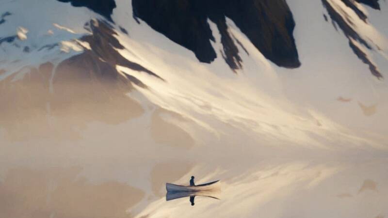 solitary and alone journey boat lonely isolation in snowy mountain range lake rowing separated naso