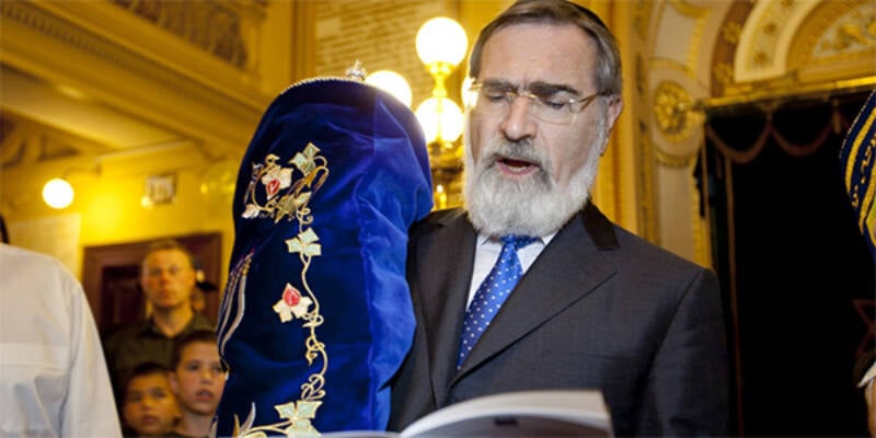 In Australia Rabbi Sacks holding sefer torah pic learning centre