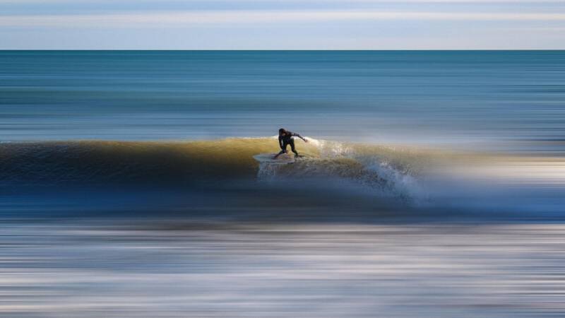 surfer riding the wave bravery risk adventure challenge crest ocean danger