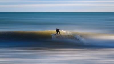 surfer riding the wave bravery risk adventure challenge crest ocean danger 1