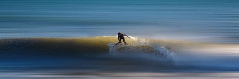surfer riding the wave bravery risk adventure challenge crest ocean danger 1