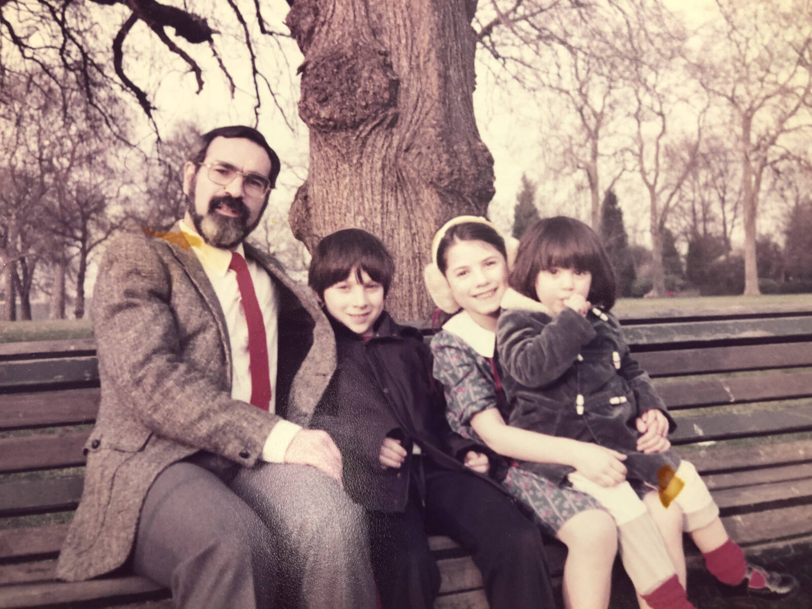 Rabbi Sacks with his children Joshua Dina and Gila in the 1980s park bench