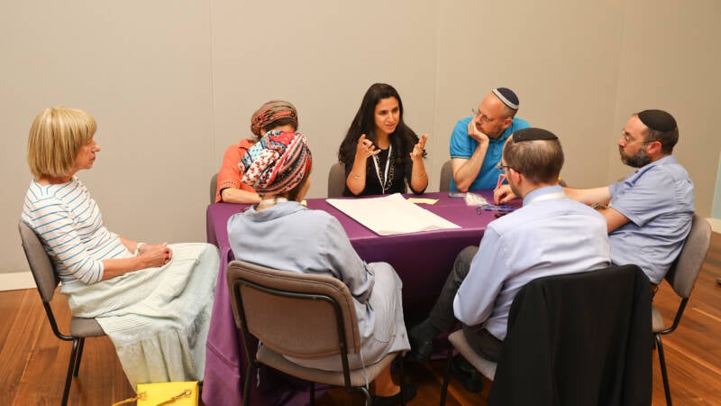 Mijal bitton action headshot at scholars retreat breakaway group 202