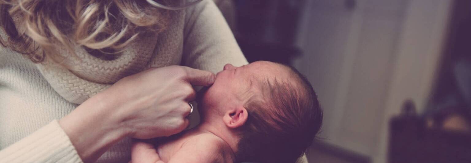 mother parenting newborn baby child holding close embrace hug care 1536x1025 1