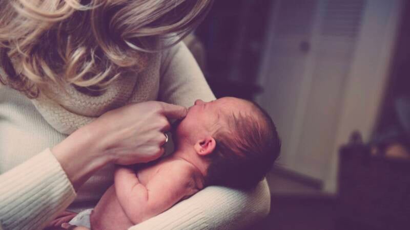 mother parenting newborn baby child holding close embrace hug care 1536x1025 1